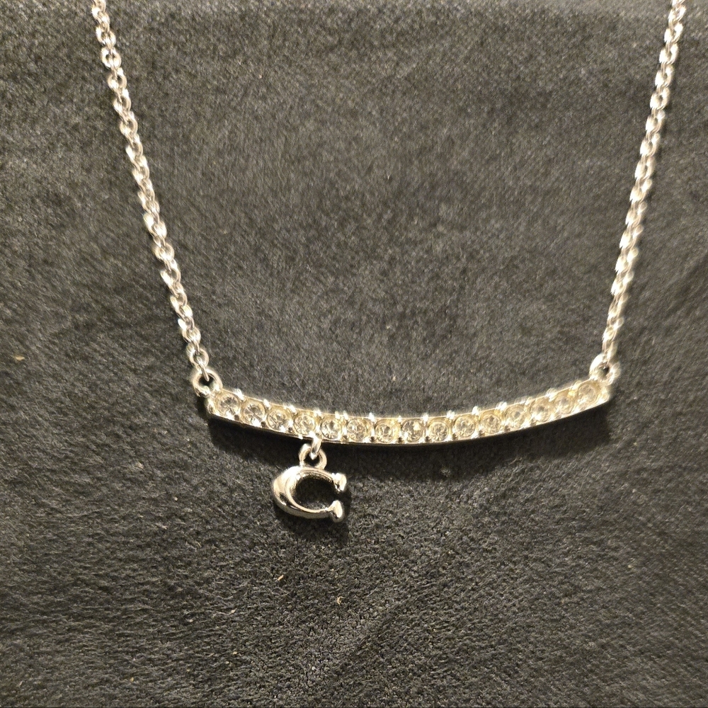 Elegant Silver Coach Necklace with Crystal Accents